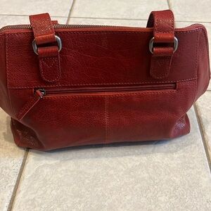 NWOT Spikes and Sparrow dark red leather purse. Front zip compartment